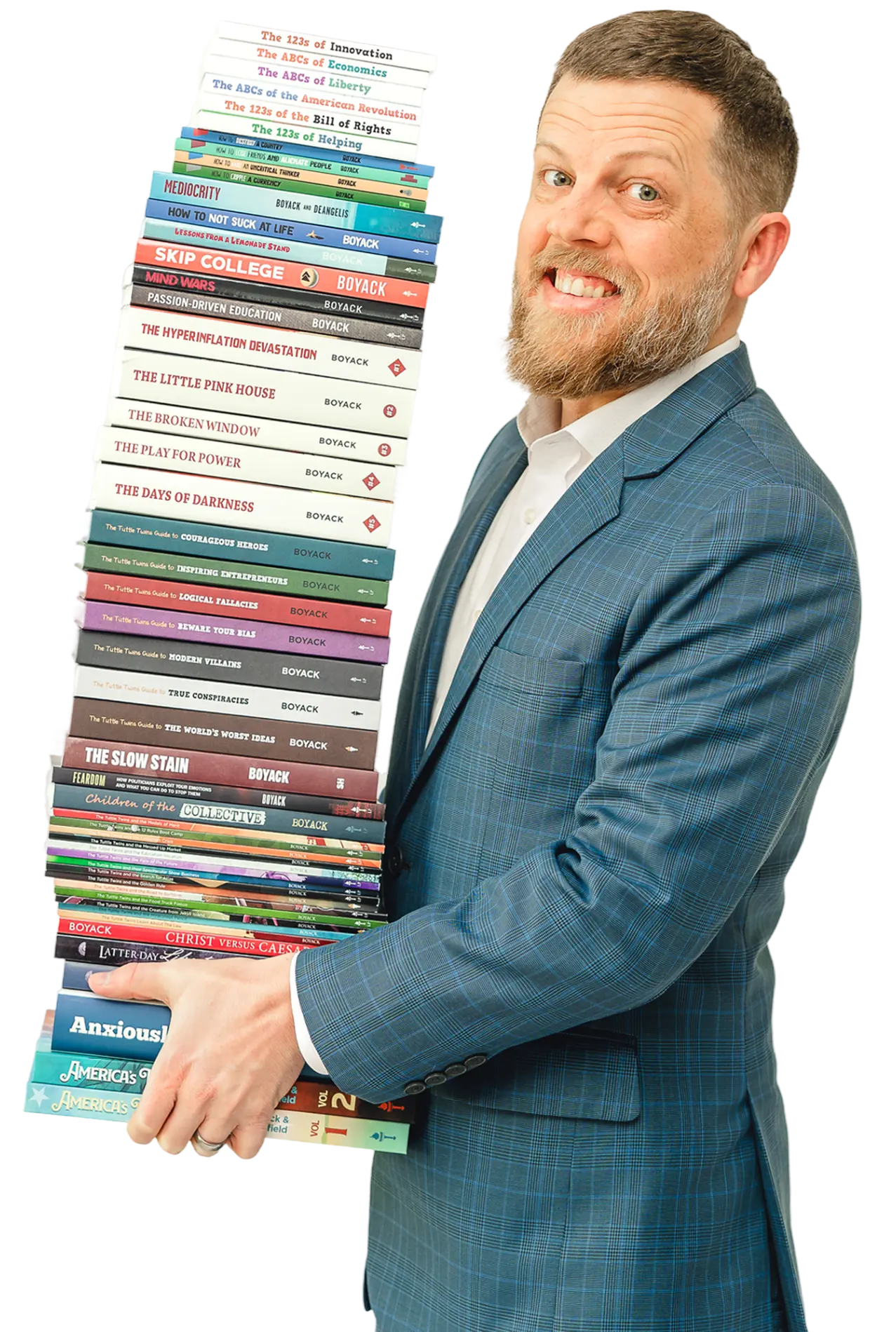 Man in a suit holding a tall stack of books.