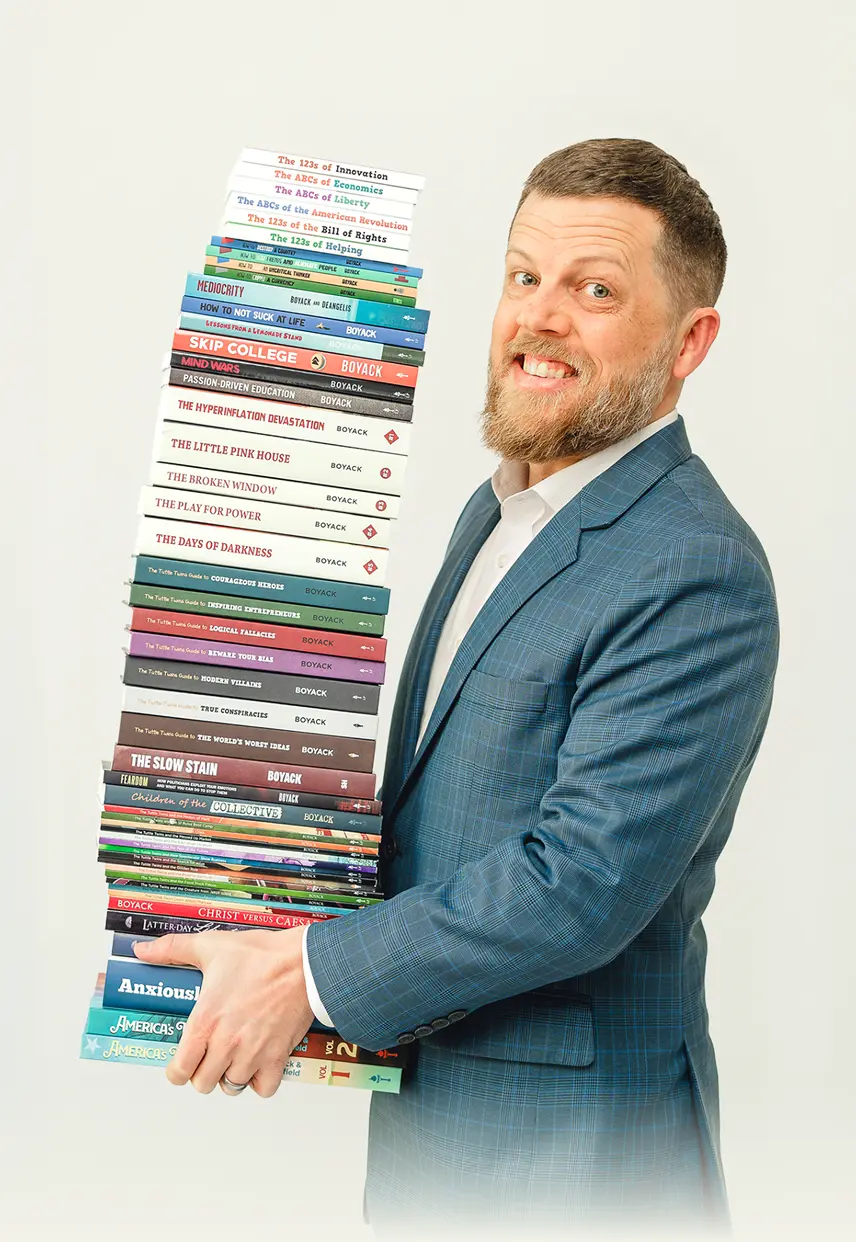 Man holding a tall stack of books.